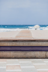 Symbol of an arrow on the wooden walkway in indicating the entrance to the beach