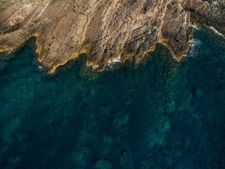 The rocky shore of the Adriatic Sea in Montenegro, aerial top view.