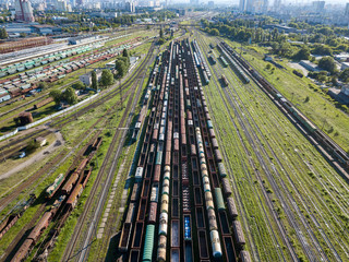 Freight trains on the railroad at the depot. Aerial view.