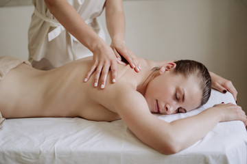 Girl Patient Relaxation During Massage at Spa