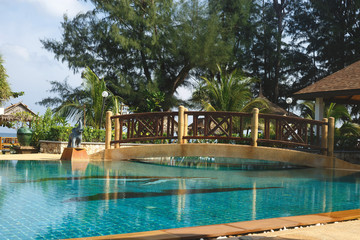 pool view with bridge and elephant figurines