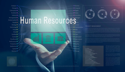 Businessman outreached hand holding a Human Resources business concept on a computerised screen display.