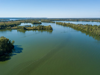 Panoramic view of the Dnieper river in Kiev. Sunny clear day. Aerial drone view.