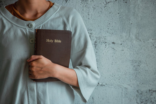 Woman Holding The Bible In Hands, Concept For Faith, Spirituality And Religion