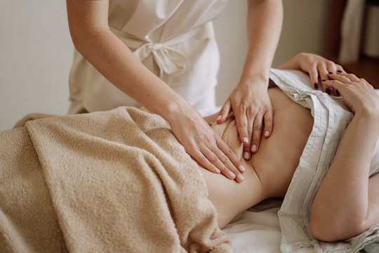 Masseuse Hands Kneading Woman Stomach Midsection