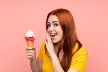 Young girl with a cornet ice cream over isolated background whispering something