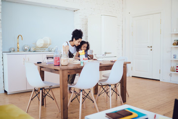 Mother and daughter cooking together