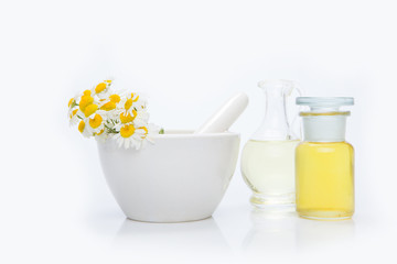 Herbal medicine products and medicine grinder isolated on white background