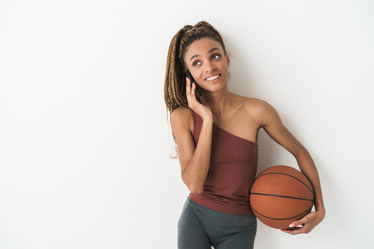 African Sports Woman With Basketball Talking By Mobile Phone