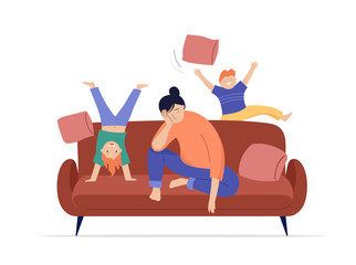 Tired mother sits on sofa, children play, jump and run around her