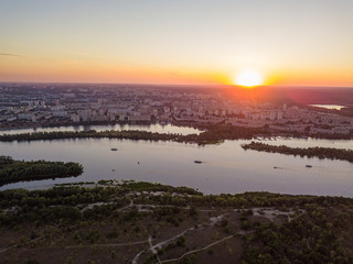 Aerial drone view. Sunset over the Dnieper River and the city of Kiev.