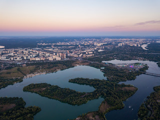 Aerial view. Dnieper river and Kiev city at dusk.