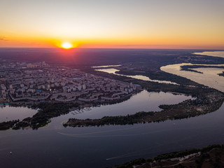 Aerial drone view. Sunset over the Dnieper River and the city of Kiev.