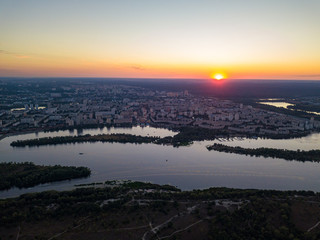 Aerial drone view. Sunset over the Dnieper River and the city of Kiev.