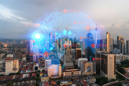 Glowing hologram of Earth planet map on aerial panoramic cityscape of Kuala Lumpur at sunset, Malaysia, Asia. The concept of international business in KL. Multi Exposure.