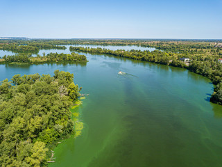 Aerial drone view of the Dnieper river. Green texture from blooming algae in the river.
