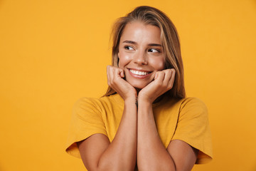 Image of blonde joyful woman smiling and looking aside
