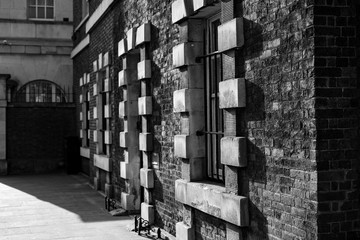 London brick and stone exterior, black and white, high-contrast