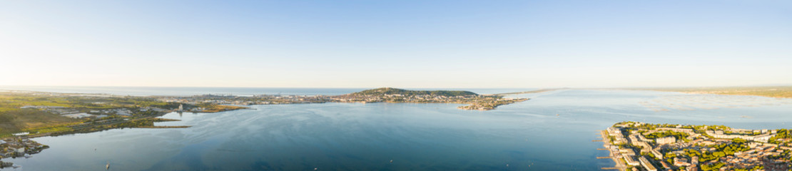 Aerial panoramic of the Thau lagoon and Mont-Saint-Clair from Balaruc, in Hérault in Occitania, France