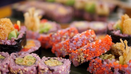 Close up of colorful vegan sushi rolls. Healthy organic asian plant-based food