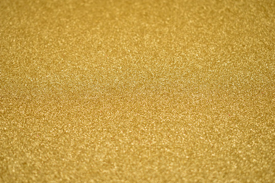 Golden glitter texture background stock images. Golden glittering abstract background stock images. Shiny festive background with copy space for text. Gold shimmer backdrop