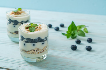 fresh blueberries and yogurt with granola