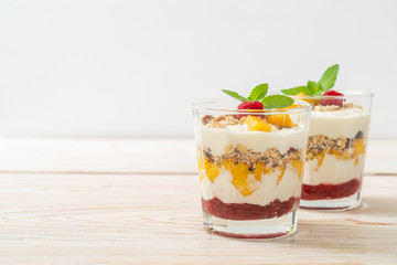 homemade mango and raspberry with yogurt and granola