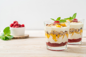 homemade mango and raspberry with yogurt and granola