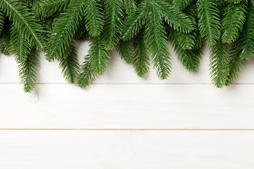 Top view of fir tree on wooden background. Christmas concept with copy space