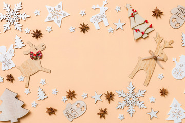 Festive decorations and toys on orange background. Merry Christmas concept with copy space
