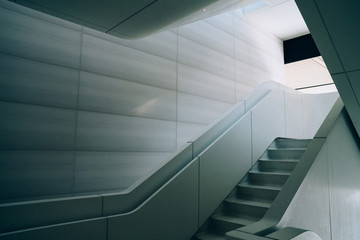 Modern interior design of concrete staircase with beautiful interior light. Contemporary architecture construction with clear space design