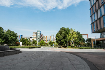 Fototapeta na wymiar Park with trees and fountains in front of the Business Center
