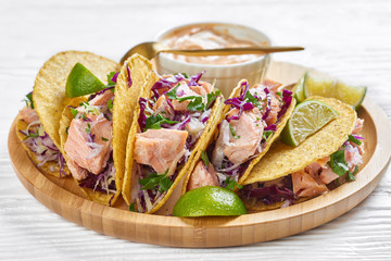 close-up of fish tacos with red cabbage salad