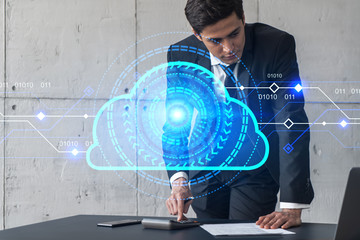Businessman signs contract and data cloud icon hologram. Double exposure. Formal wear.