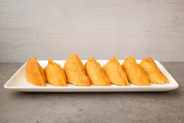 Tofu sushi on a white background