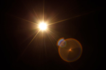 Easy to add lens flare effects for overlay designs or screen blending mode to make high-quality images. Abstract sun burst, digital flare, iridescent glare over black background.