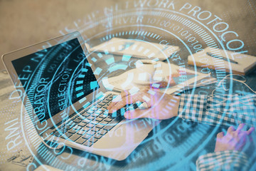 Businessman with computer background with technology theme hologram. Concept of hightech. Multi exposure.