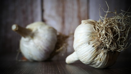 garlic on the wooden table, food illustration on the wooden background
