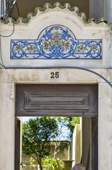 Fototapeta na wymiar old Portuguese traditional ceramic tiles Azulejos on a wall in Aveiro, Portugal.