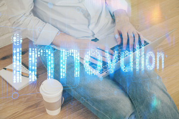 Fototapeta premium Multi exposure of technology hologram with man working on computer background. Concept of big data.