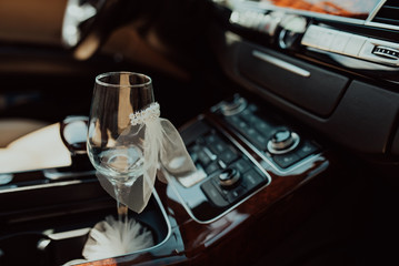 Fototapeta na wymiar bottle of champagne and glass in luxury car