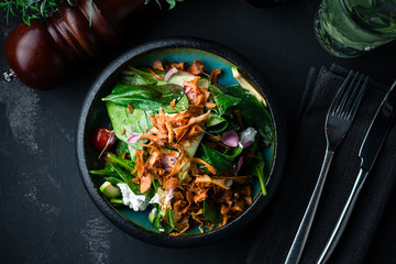 fresh salad with cheese in an expensive restaurant