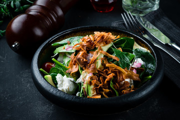 fresh salad with cheese in an expensive restaurant