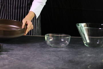 person holding a Tray , preparing to bake Bread