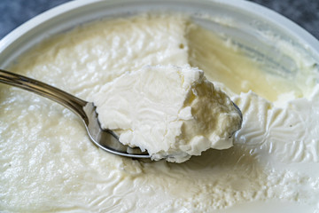 Instant Sheep Yogurt / Yoghurt with Spoon in Plastic Cup.