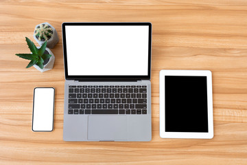 Flatlay of laptop, cellphone and tablet with blank screen