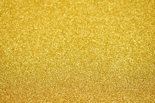 Golden glitter texture background stock images. Golden glittering abstract background stock images. Shiny festive background with copy space for text. Gold shimmer backdrop