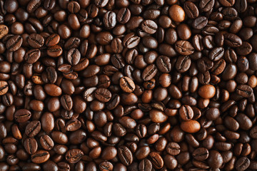 The background is made of high-quality natural aromatic roasted coffee beans, which will be ground and become a delicious coffee drink.