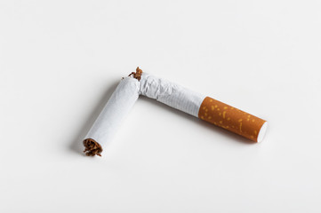 broken cigarette on a white background,