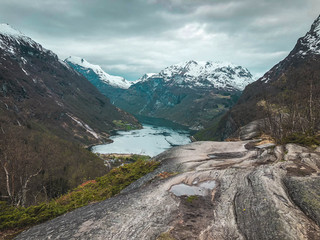 Fjord Geiranger Fjord with ferry boats, view from Ornesvingen viewing point, Norway. Travel destination